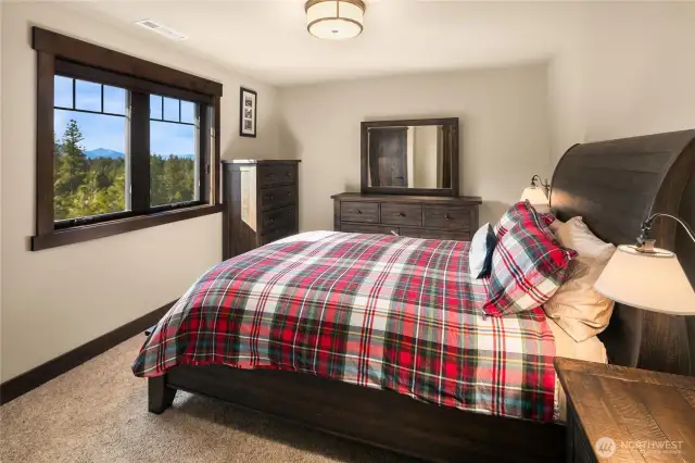 Upstairs second bedroom has lovely views and plenty of space as well as private entrance to connected full bath.