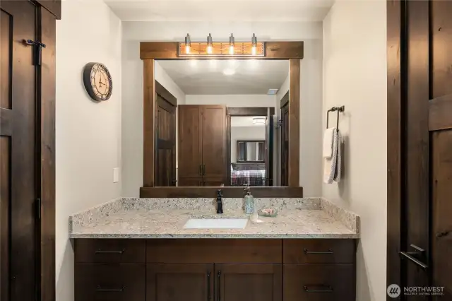 Full bath in hall off music room. Jack and Jill entrance to second bedroom. Laundry chute in cabinet makes for easy housekeeping.