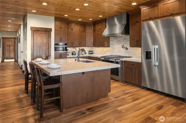 Thoughtful floorplan flows easily from kitchen space down the hall to office, half bath, laundry room and entrance to the garage.