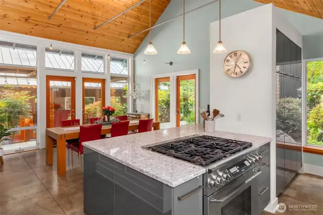 Chefs' kitchen with 6-burner gas cooktop.