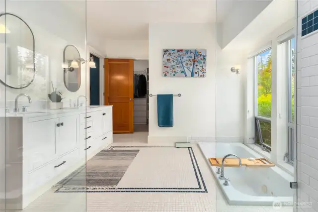 Primary bathroom with radiant tile floors.