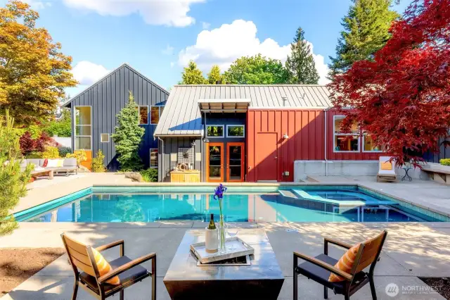 Heated pool and spa with automatic, retractable safety cover.