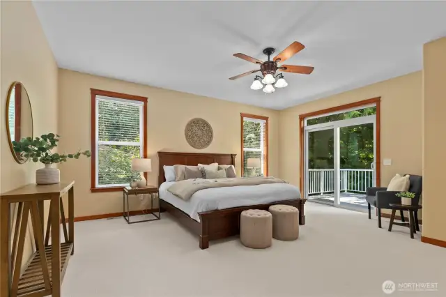 Your main level primary bedroom with en-suite and private deck