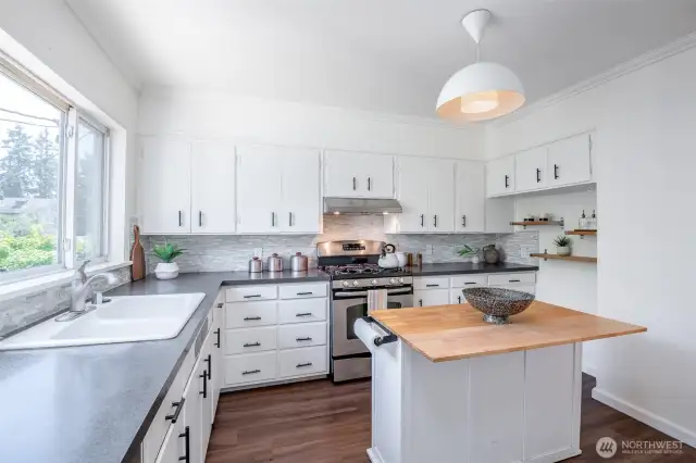 This bright kitchen has ample storage and is ready for you to cook a great meal!