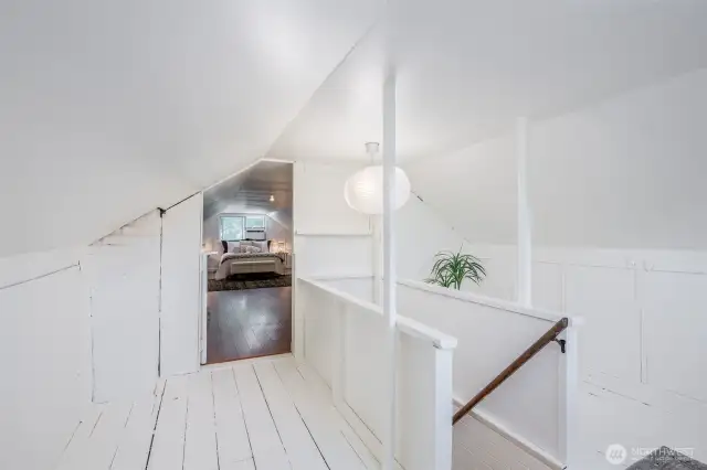 This landing could be used for an office, reading nook, or extra closet space.