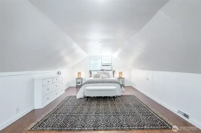 Enjoy this spacious, bright primary bedroom.
