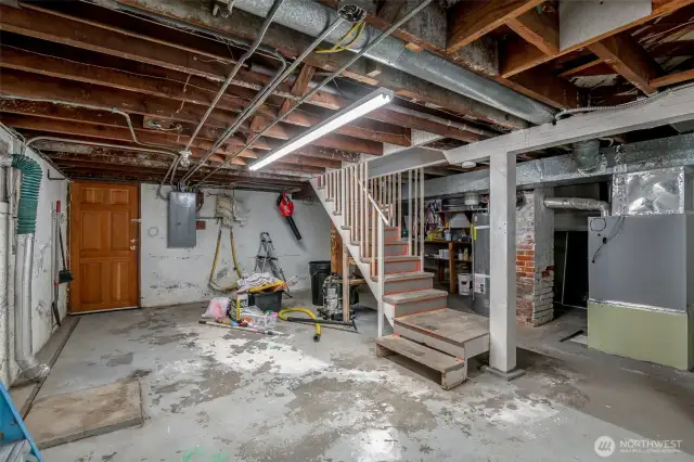 This unfinished basement offers plenty of storage and easy outside access.