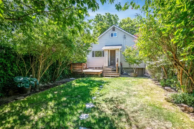 Sprinkler system helps to keep this lush yard feeling like an oasis in the city.