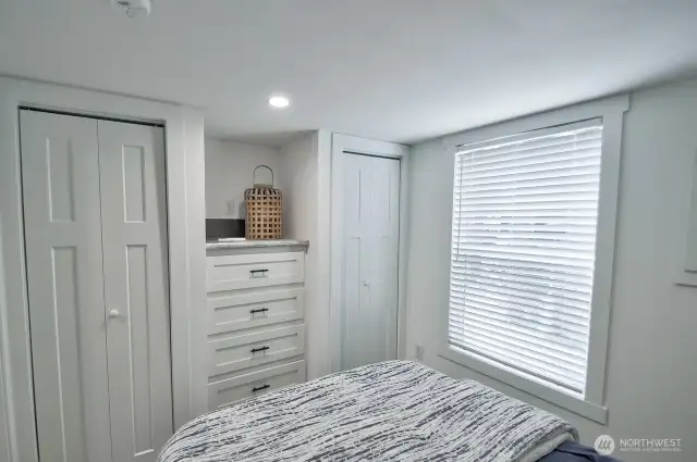 BEDROOM WITH BUILT IN CABINETS, DRAWERS AND MINI SPLIT FOR HEAT AND AIR