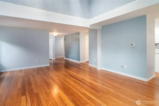 Here's an un-staged photo of the beautiful living room in this one-level, golf course view, 3-bedroom condo. Vaulted ceilings, diagonal ship lap siding and mini-ductless split equals comfort, functionality and beauty.