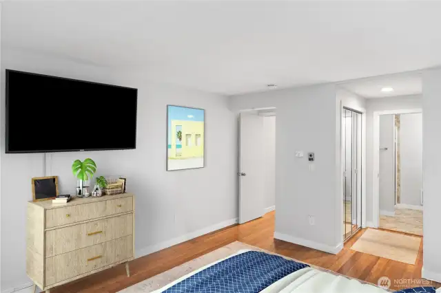 The primary bedroom is privately located in the condo, and it has two closets, a 3/4 bath and the TV in the photo conveys.