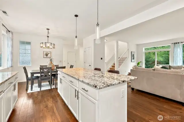 Large, open floorplan. View to upstairs and patio doors.
