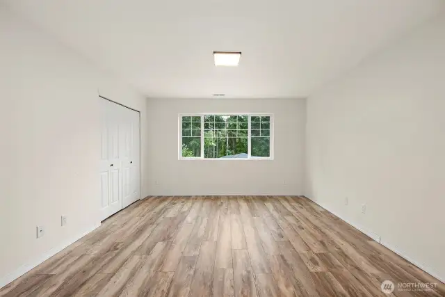 Upstairs bedroom 4 or bonus room with French doors and view to front.