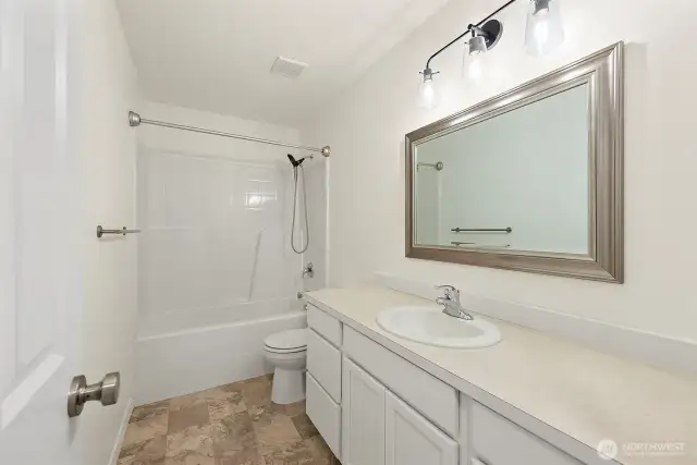 Upstairs full bath. Clean, modern finishes.