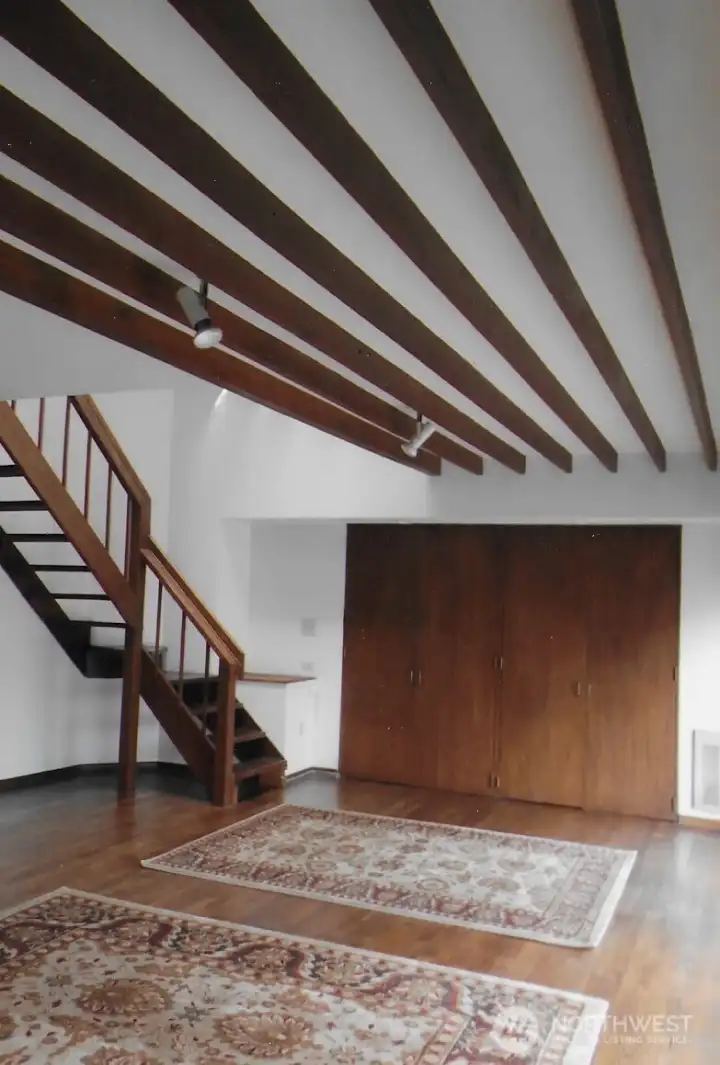 Open great room with stairs up to bedroom and loft