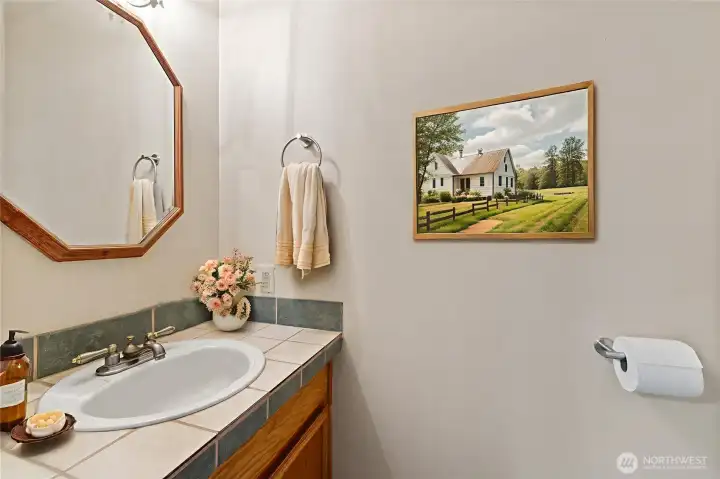 Half bath on the main level is virtually staged.