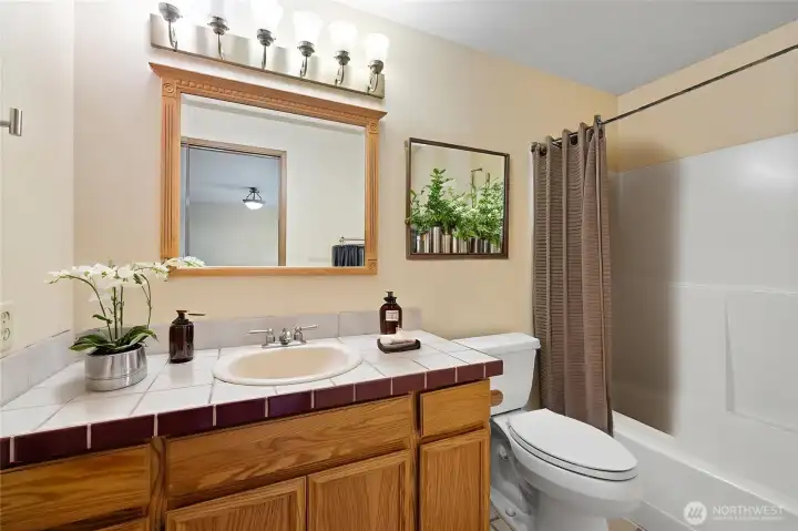 Primary bathroom is virtually staged.