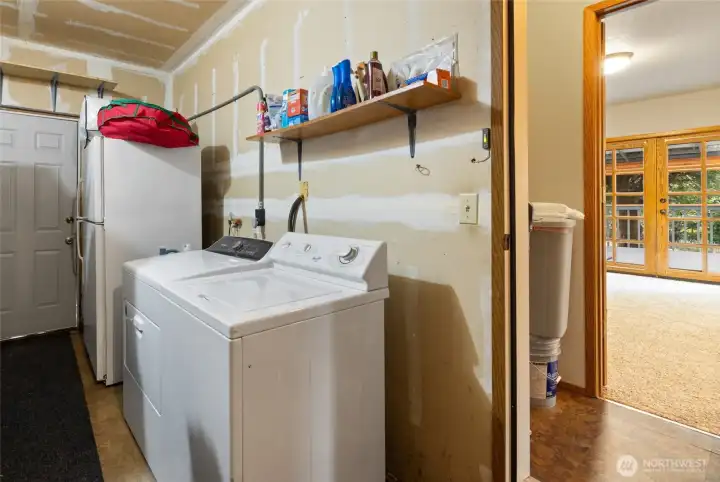 There are additional washer/dryer hookups in the garage, just out the door from the utility room currently being used as a pantry. So, you could have one set in the house and another in the garage.