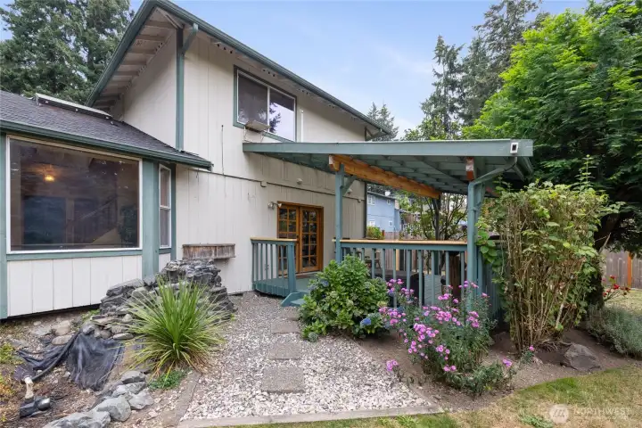The large covered back deck is a great place for entertaining or relaxing year-round.
