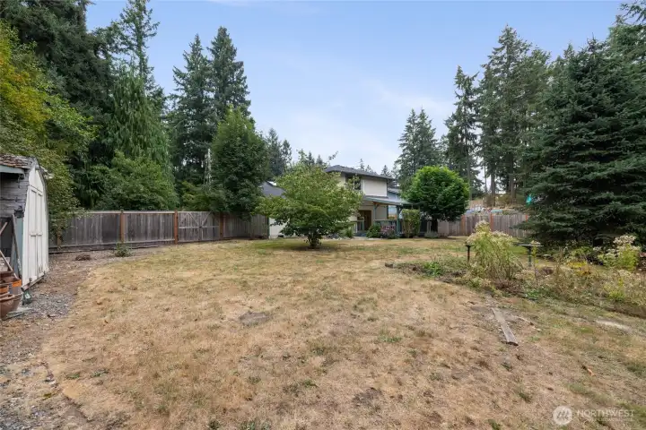 You can have that garden you've always dreamed of here! There is also a drive through gate in the fence that can be seen in this photo.