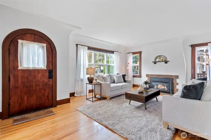 Enjoy rich hardwood floors, coved ceilings and the warmth of a Batchelder tile fireplace