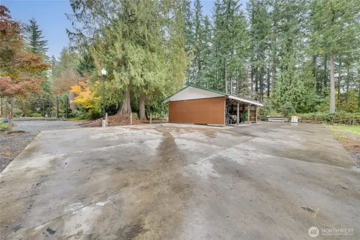 Tucked Away with a dedicated Rear Access Driveway ~ 6000sqft Cement Pad + 24' x 36' Pole Barn ~ Fully Fenced 6 Bed Garden AND Entire Property Surrounded by Invisible Fence keeping your pets secure.