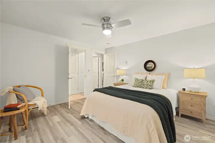 Primary bedroom with access into the bathroom