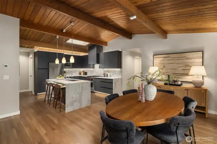 Perfectly reimagined kitchen with waterfall island, custom cabinetry, and high end appliances.
