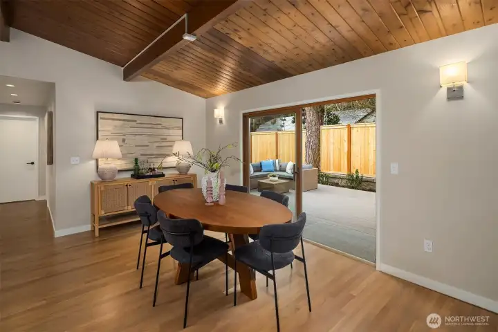 Generous dining room opens through the sliders to the new Trex deck, a seamless blend to the outdoors.