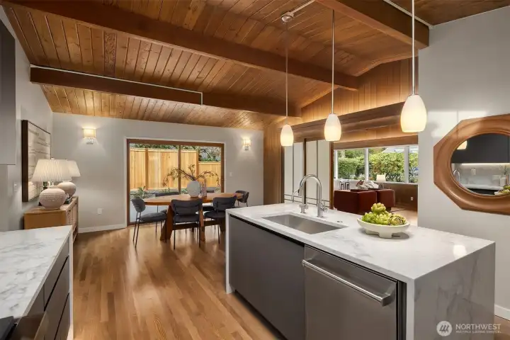 Picturesque windows showcasing privacy fence and mature greenery.