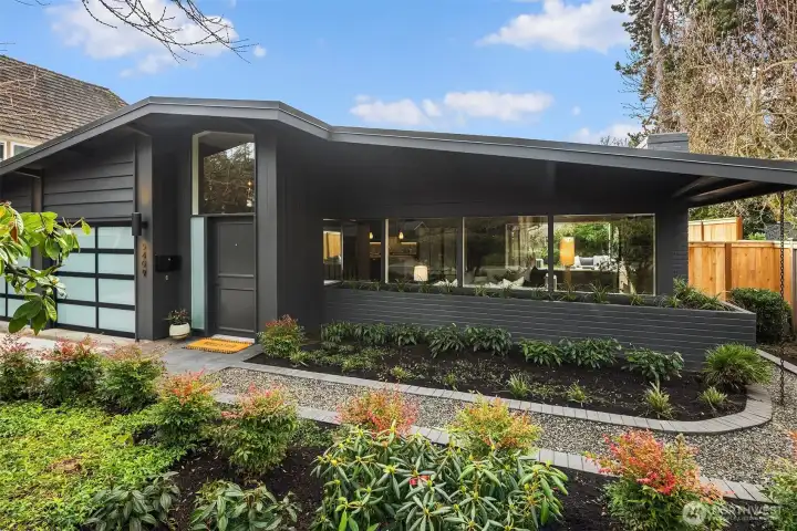 A close up of the front- professionally landscaped with sprinklers for easy care.