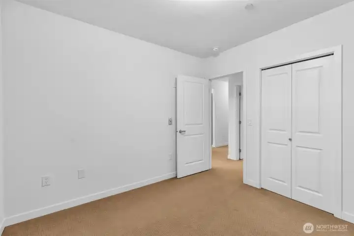 Bedroom with walk-in closet.