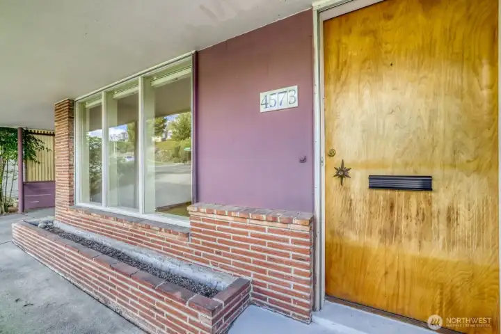 So many original architectural details throughout this home. Check out the star design around the doorknob!