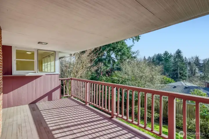 Main Floor deck with passthrough window from Kitchen. Plenty of room for dining or just hanging out. Gorgeous territorial views from here, too!