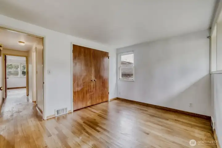 Bedroom #2 on Main Floor. Another double-door step-in closet and plenty of windows to let all that natural light in.