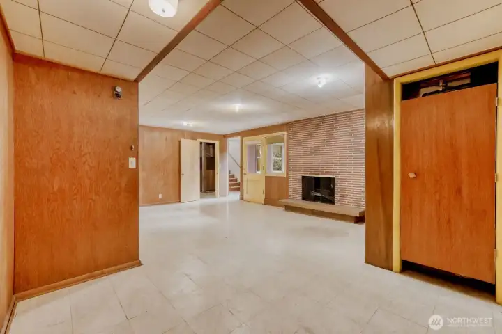 Rec Room/Game Room in Daylight Basement. The door to the right is the furnace closet.