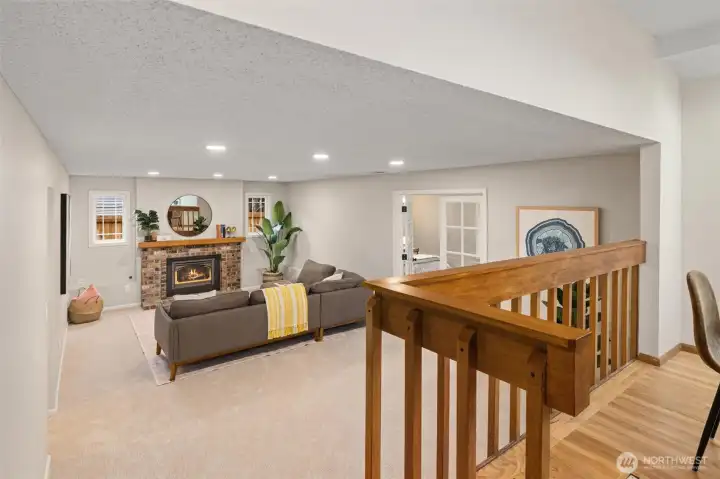 Lower level living room with cozy gas fireplace.