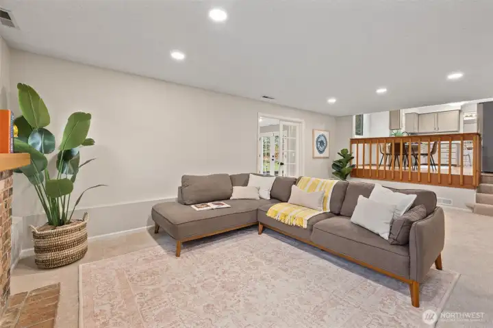 Alternate view of lower level living room with recessed lighting.