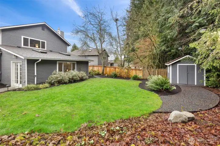 Level lawn backs up to greenbelt.