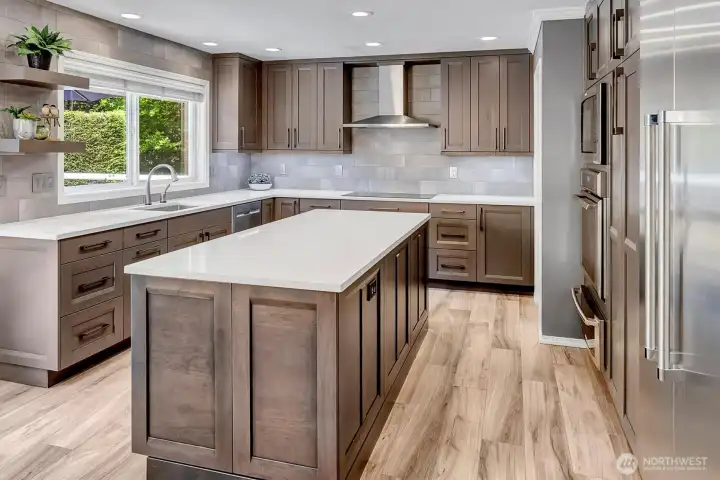 This kitchen is spectacular in every way. Custom designed for flow and functionality w/custom hardwood, soft close cabinets + drawers. Gorgeous island, countertops, designer tiles, hardware, and stunning, heated floors. Professional SS appliances include, Thermadore + Electrolux. Built in, abundant and beautiful in every way! This is truly a fully appointed Chef's kitchen and a dream for those who love to cook and...entertain! This kitchen is spectacular in every way. Custom designed for flow and functionality w/custom hardwood, soft close cabinets + drawers. Gorgeous island, countertops, designer tiles, hardware, and stunning, heated floors. Professional SS appliances include, Thermadore + Electrolux. Built in, abundant and beautiful in every way! This is truly a fully appointed Chef's kitchen and a dream for those who love to cook and...entertain!