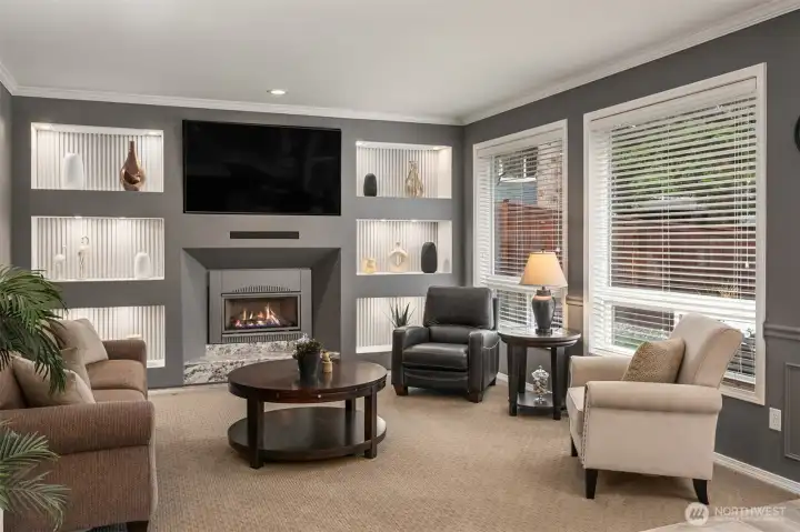 Warm and inviting is the great room. Custom designed focal wall w/display lighting, custom millwork granite, gas fireplace surround. Backing to the private, green....nature filled back yard is what makes this home a truly, special home. Warm and inviting is the great room. Custom designed focal wall w/display lighting, custom millwork granite, gas fireplace surround. Backing to the private, green....nature filled back yard is what makes this home a truly, special home.