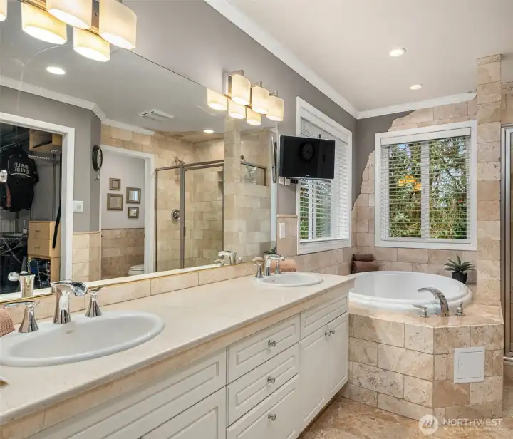 Beautifully designed primary en'suite bath w/custom shower, jetted spa tub, double vanity and heated floors. Beautifully designed primary en'suite bath w/custom shower, jetted spa tub, double vanity and heated floors.