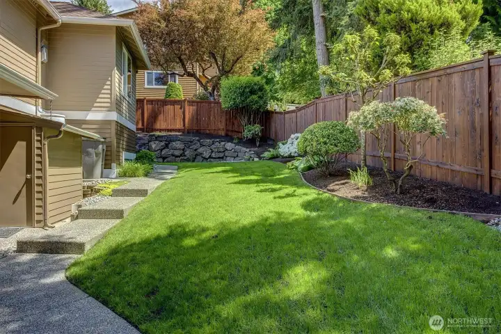 Gorgeous side/back yard w/exposed aggregate walkways + stairs, new cedar fence, beautiful stone terraces and simple, low maintenance plantings. Gorgeous side/back yard w/exposed aggregate walkways + stairs, new cedar fence, beautiful stone terraces and simple, low maintenance plantings.