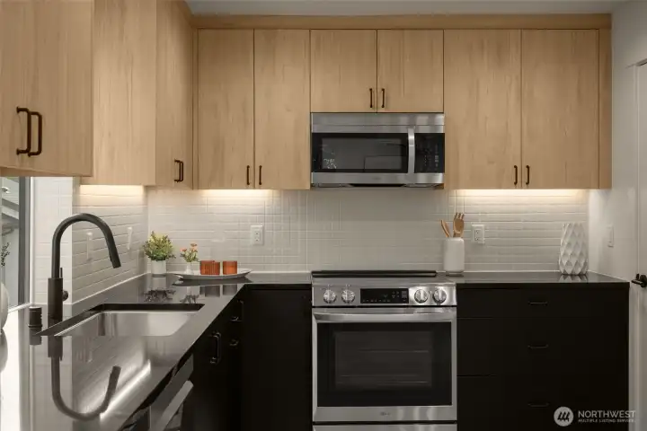 Designer kitchen with sleek cabinetry, quartz countertops, and premium appliances