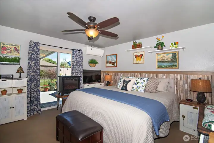 Primary Bedroom with sliding door out to patio and hottub