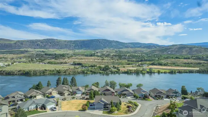 Elevated aerial highlighting home's location, corner lot setting, and stunning Columbia River views. Elevated aerial highlighting home's location, corner lot setting, and stunning Columbia River views.