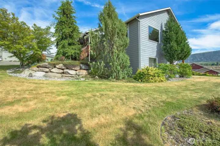 Expansive side yard and corner lot setting offering privacy, space, and room for outdoor enjoyment. Expansive side yard and corner lot setting offering privacy, space, and room for outdoor enjoyment.