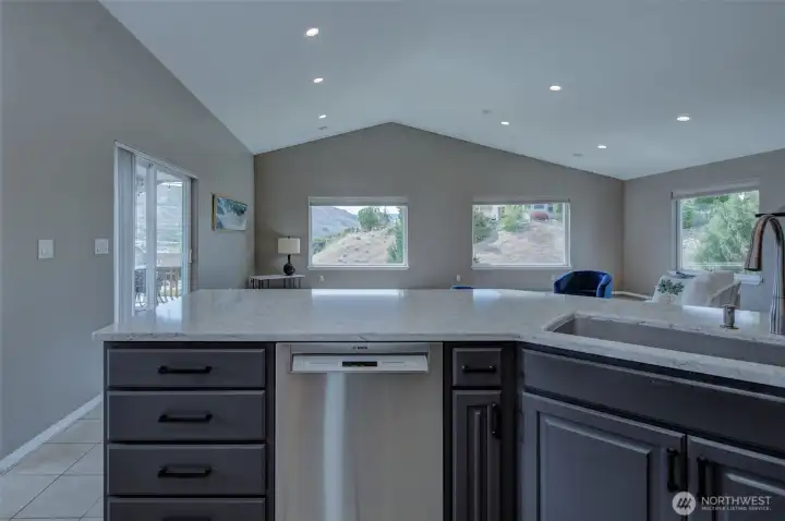 Spacious kitchen with large island, bar seating, and open design ideal for entertaining. Spacious kitchen with large island, bar seating, and open design ideal for entertaining.