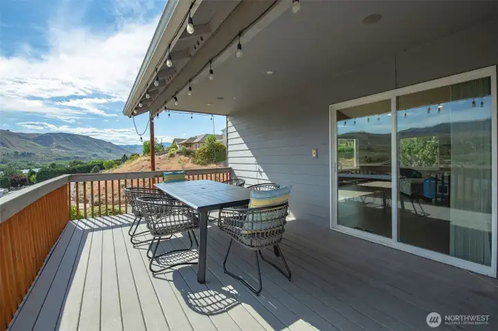 Spacious entertaining deck with panoramic views and room for outdoor dining or morning coffee. Spacious entertaining deck with panoramic views and room for outdoor dining or morning coffee.