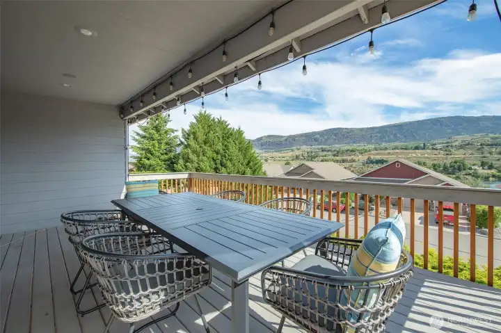 Spacious entertaining deck with panoramic views and room for outdoor dining or morning coffee. Spacious entertaining deck with panoramic views and room for outdoor dining or morning coffee.